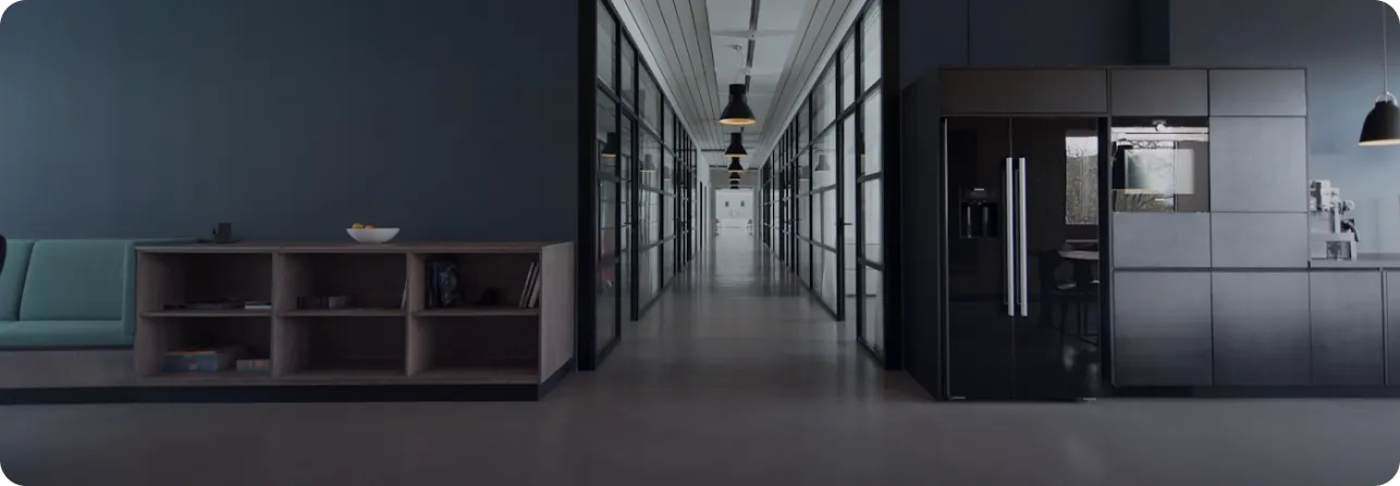 Modern office hallway with glass-walled rooms