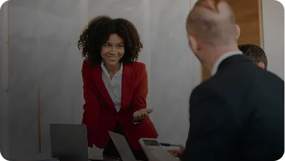 Consultant presenting with a laptop in a business meeting