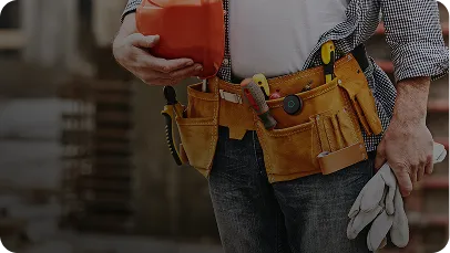 Construction manager wearing a tool belt and hard hat